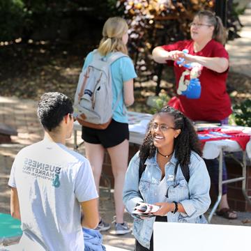 A student talks with a representative of the Business Marketing and Entrepreneurship club.